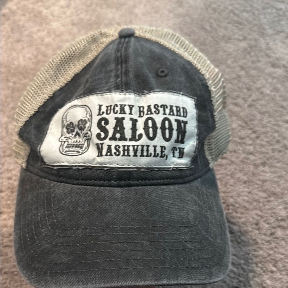 Lucky Bastard Saloon ! Straight from
Nashville! Barely worn! Good condition!